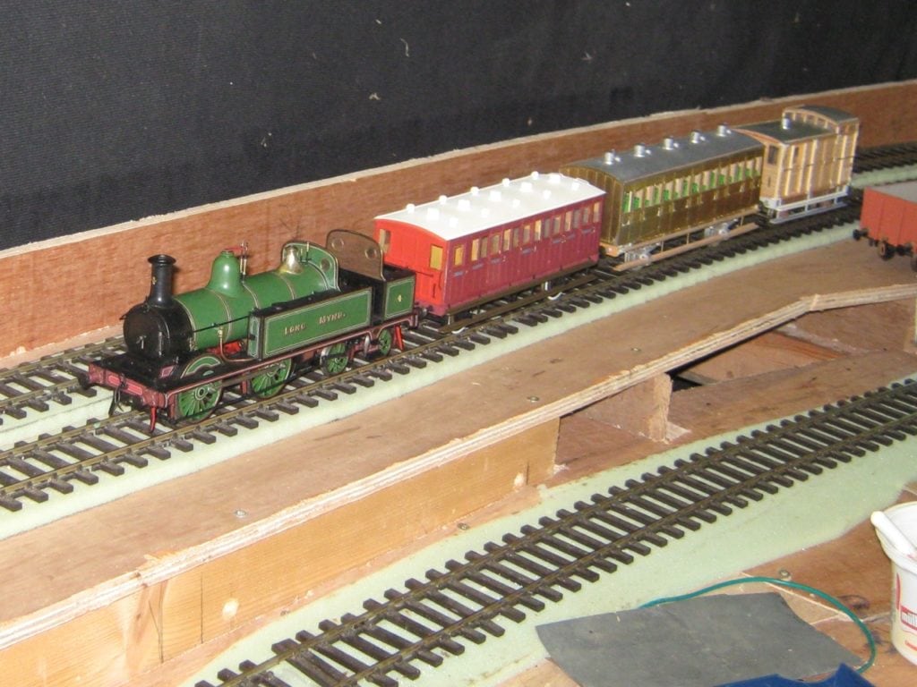 Scratch built by John M, a Victorian train threads it way through workings on the ekogg circuit October 2011 - Rob M
