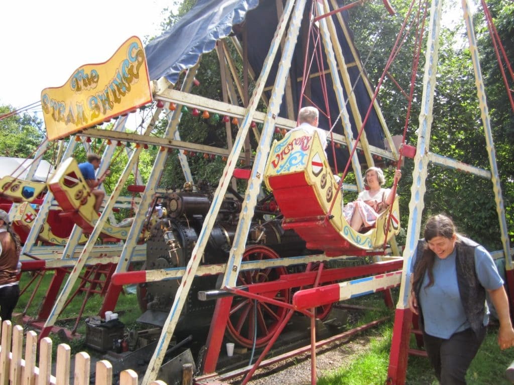 Steam assisted swing-boats at Hollycombe Fairground.  EKOGG chairman, Rob with Carole. [Kathryn Sutcliffe] August 4th