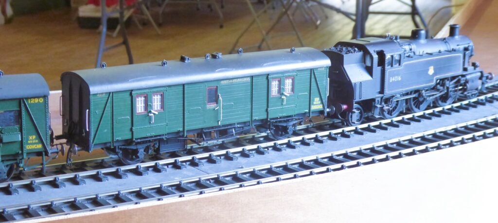 A circuit running BR 3MT 2-6-2T 84016 & SR luggage vans