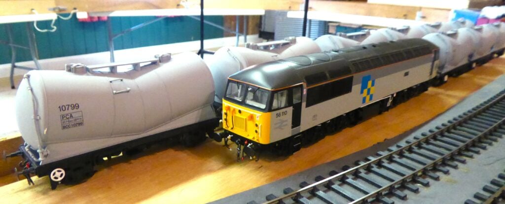 EKOGG 240427 BR Class 56 and cement wagos awaiting turn on circuit Roger